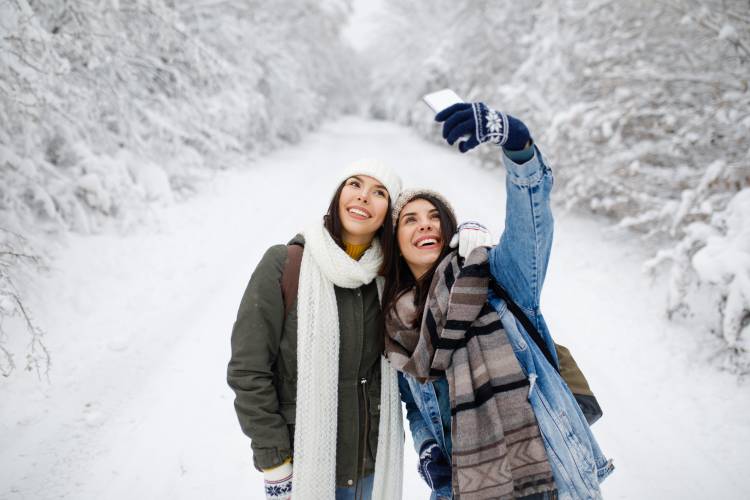two girls taking selfie in Lake Tahoe