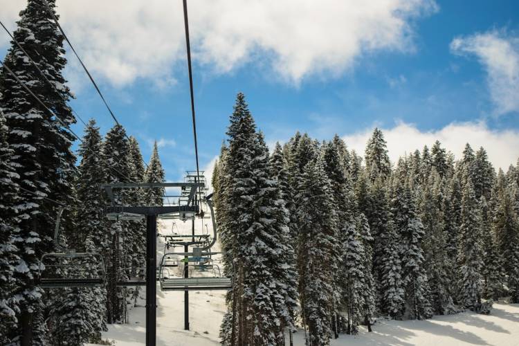 A ski lift running along a snow-covered mountainside
