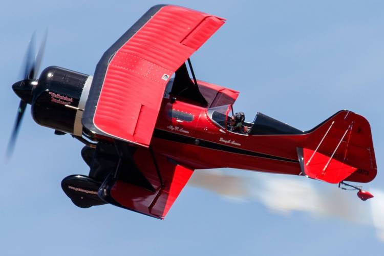 Man flying red BF9-2 Phantom biplane