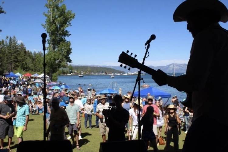 Silhouette of a musician performing to a crowd