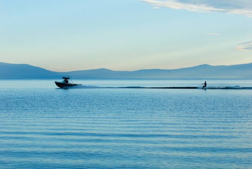 boat pulling a water skier behind it